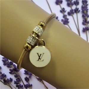 Elegant Gold and White Charm Bracelet.